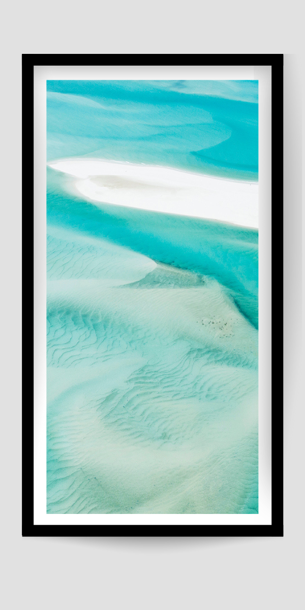 turquoise water swirling and rippling amongst white sands