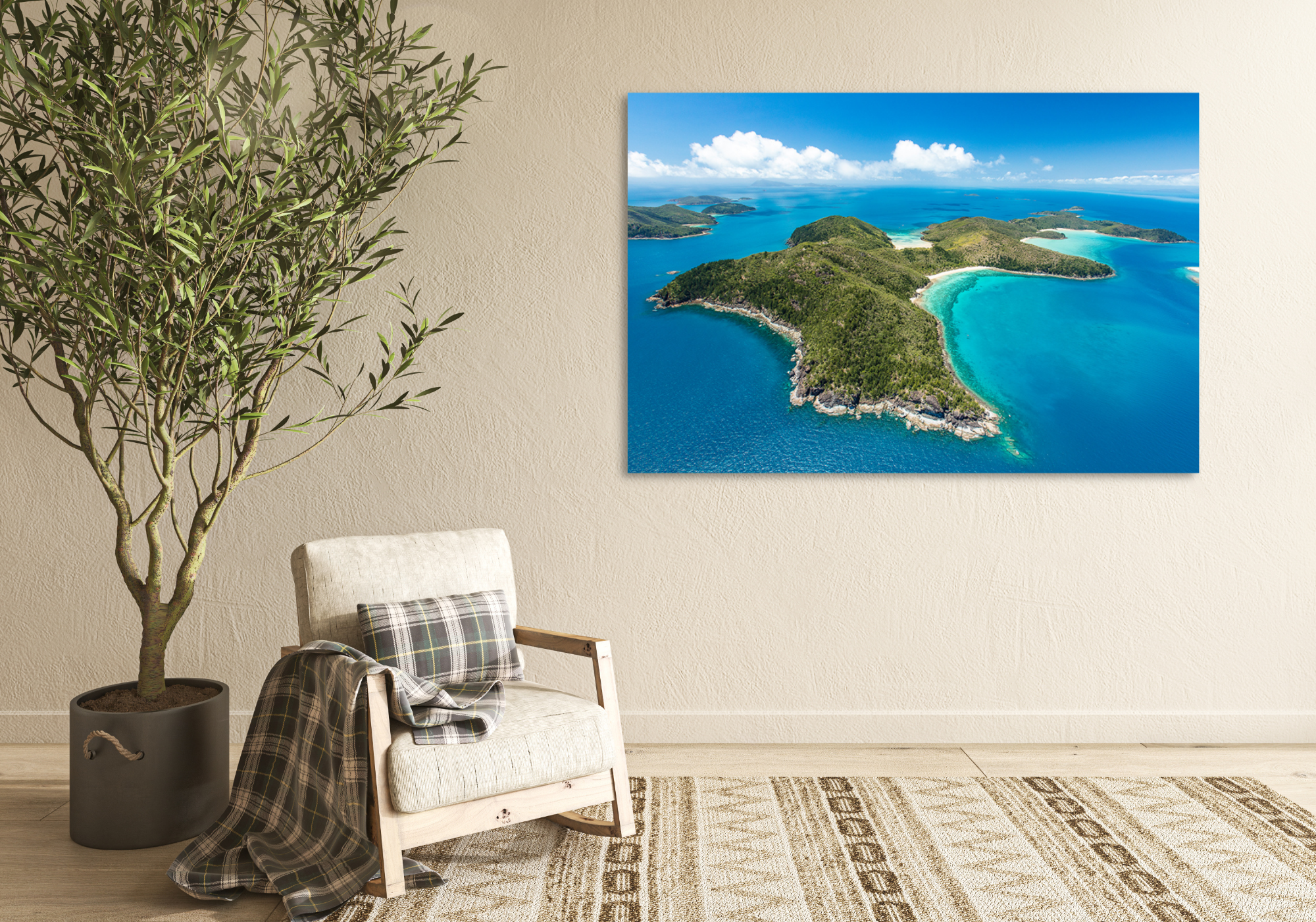 aerial of an island with bays of white sandy coral beaches and more islands in the background