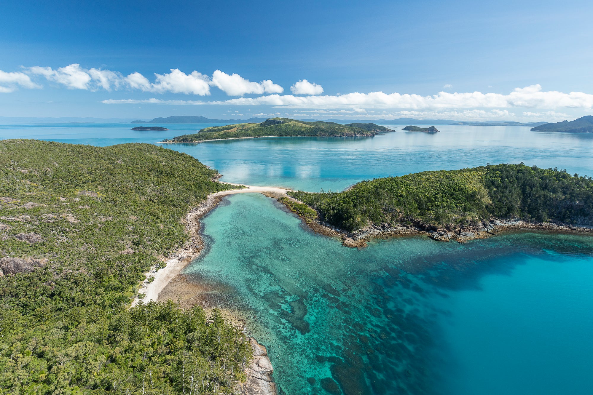 islands joined together via a narrow beach and surrounding coral reef