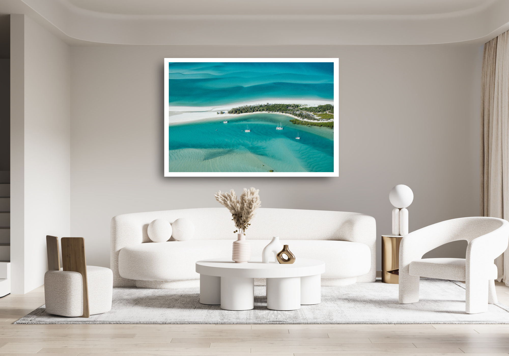 4 vessels anchored within a protected calm bay and different coloured ocean waters beyond