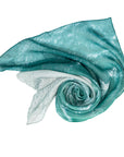 Silk scarf White Waves print from right the turquiose water waves lap at the white sand on left 