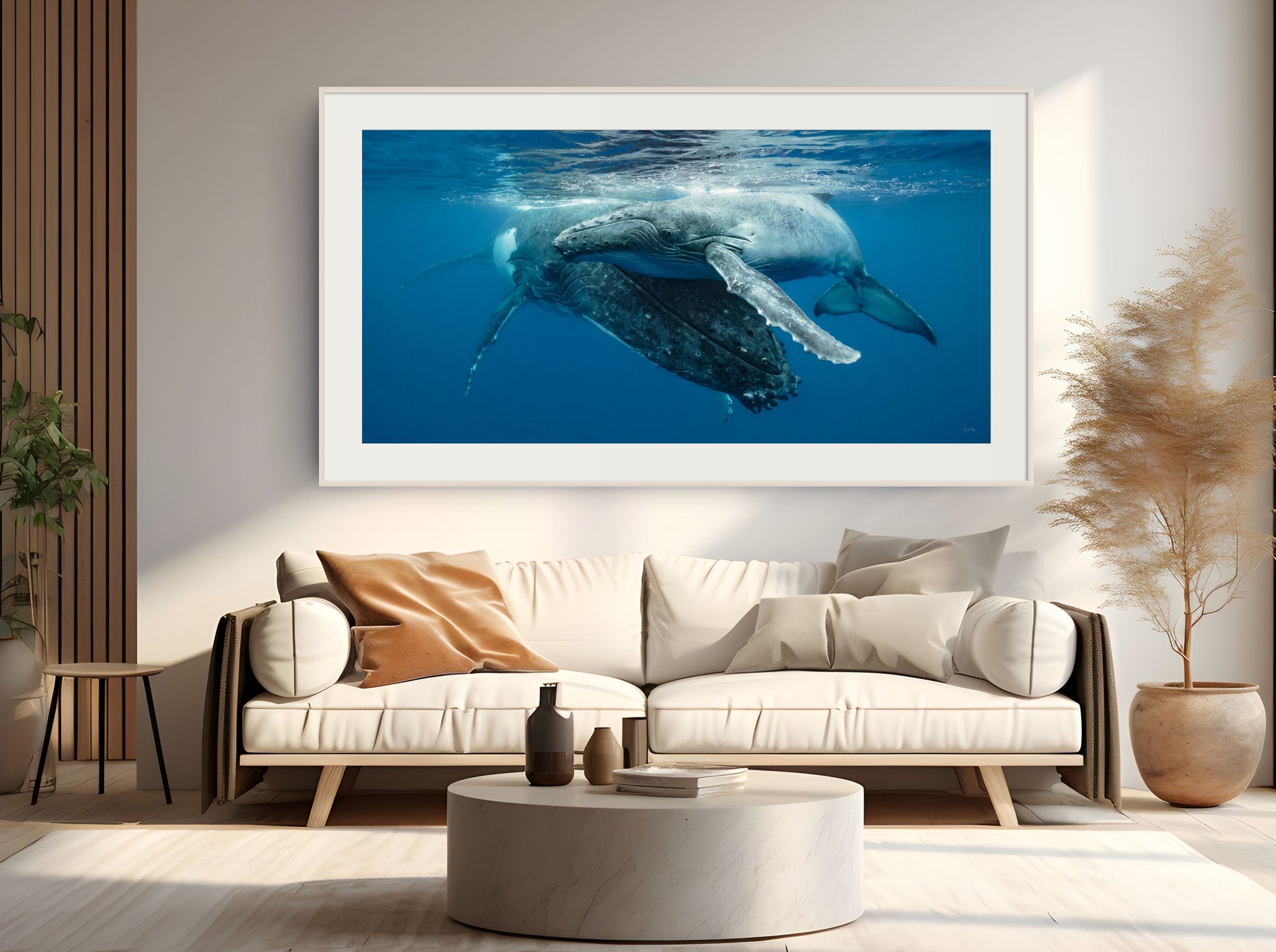 Framed photograph of a whale underwater in a living room setting.