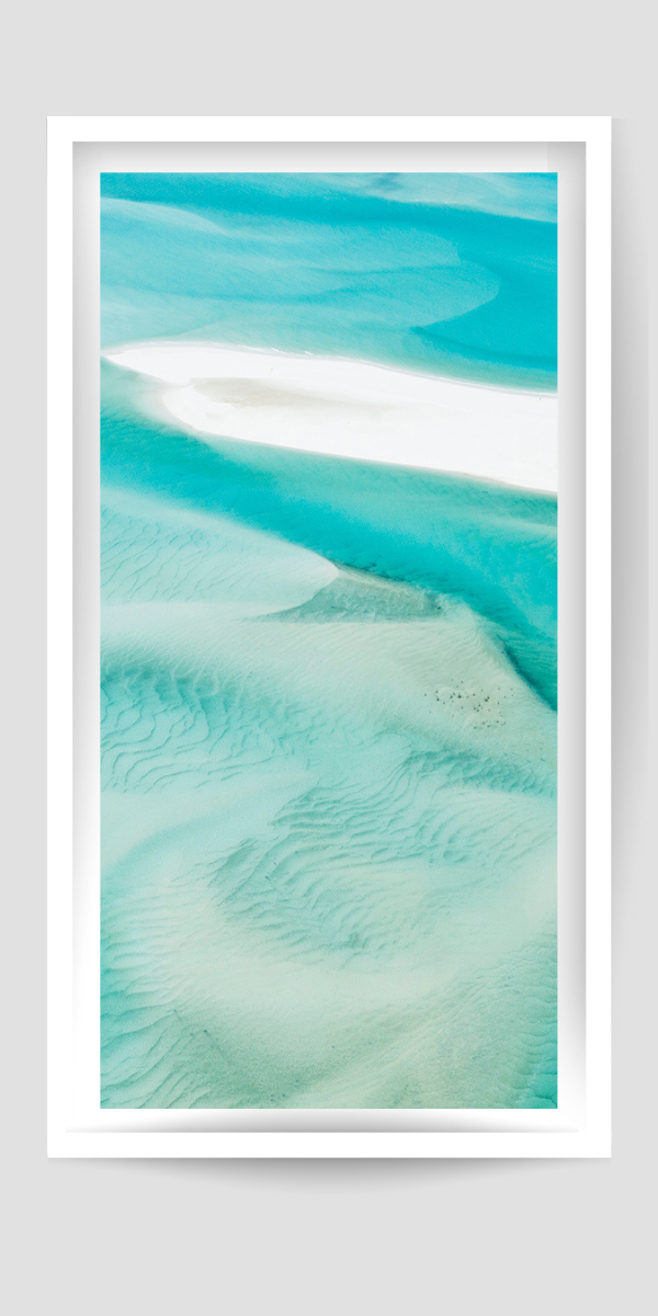 turquoise water swirling and rippling amongst white sands
