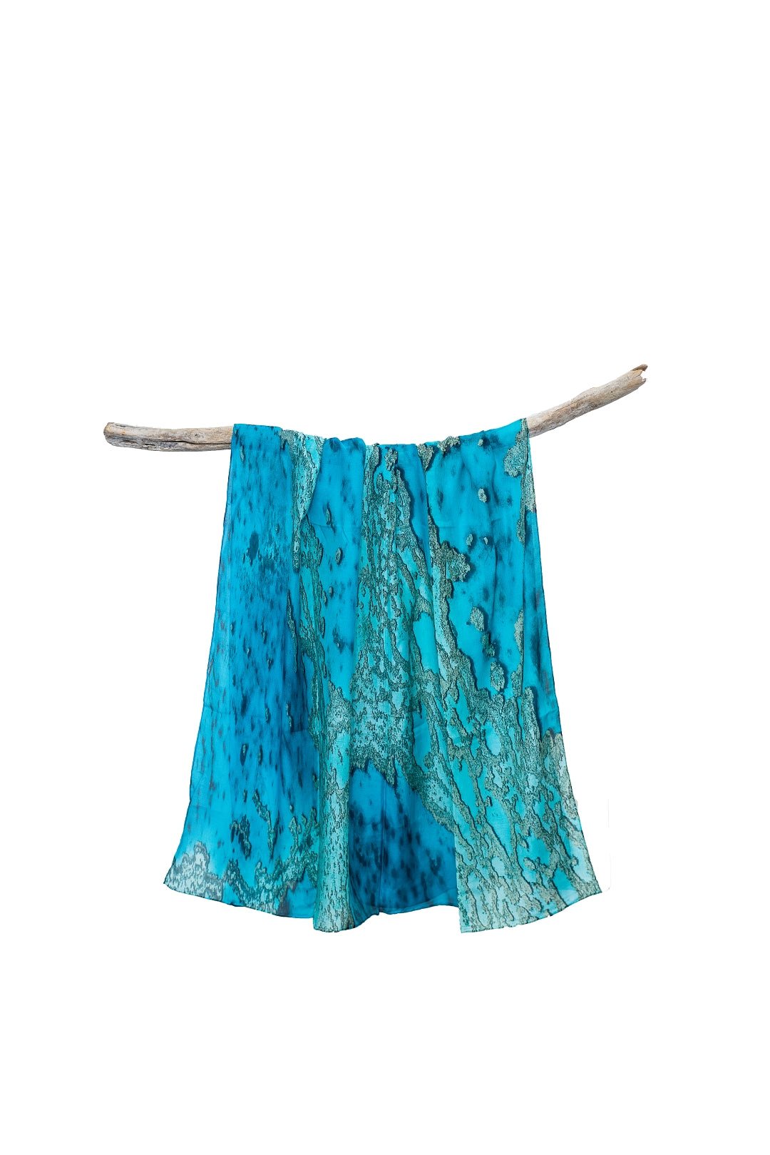 cotton silk sarong print of Coral reef veins spread across green, blue, aqua, turquise coloured water